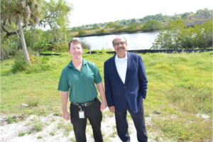 Your Observer article image of two men standing along Bradenton river